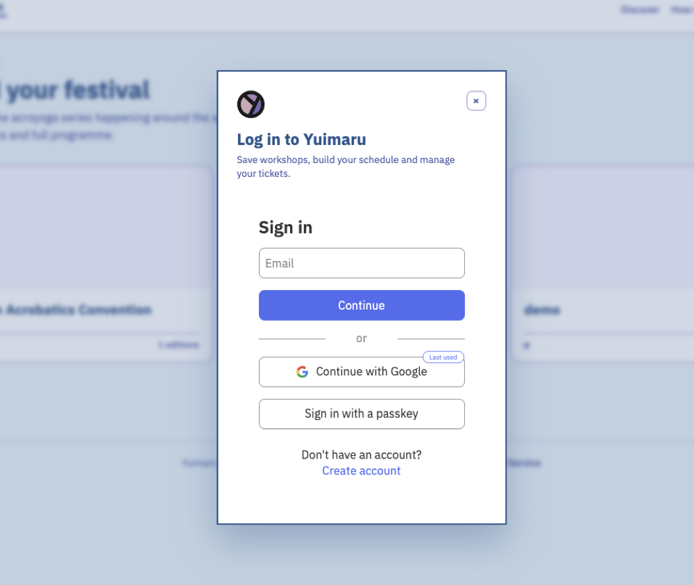 The 'Log in to Yuimaru' box: an email field and Continue button, plus Continue with Google and Sign in with a passkey, and a Create account link